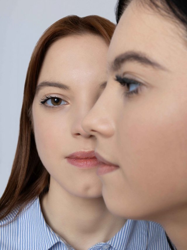 two-sisters-pose-on-a-light-background-2025-03-24-16-50-38-utc (1)