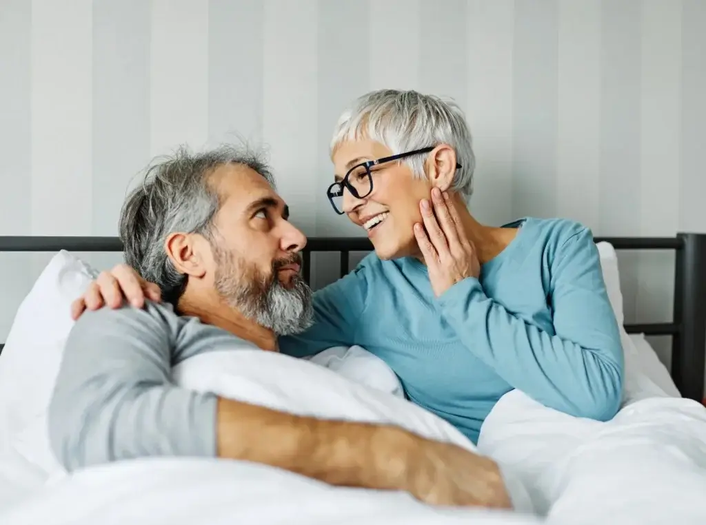 A menopausal woman enjoying an intimate moment with her husband.