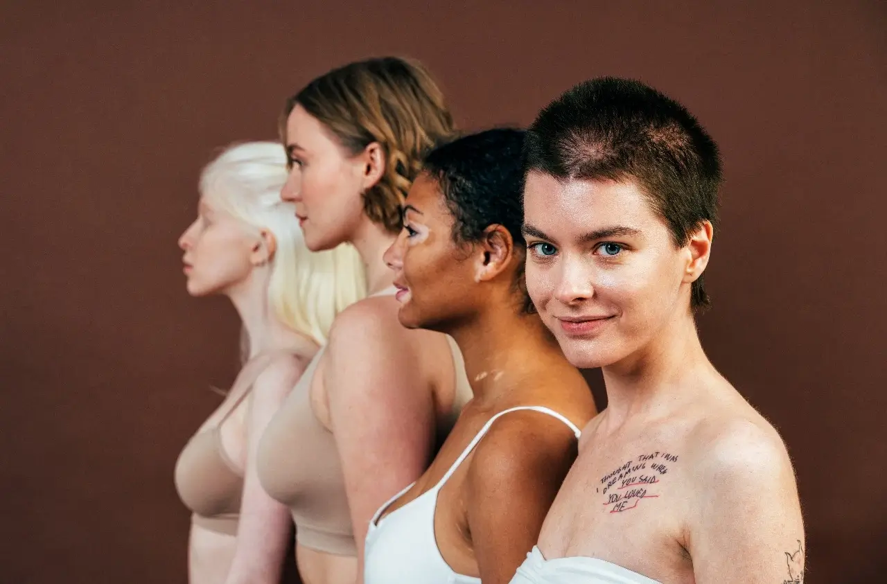 A diverse group of women standing together, each with unique skin tones, body types, and personal stories, symbolizing strength, healing, and solidarity.