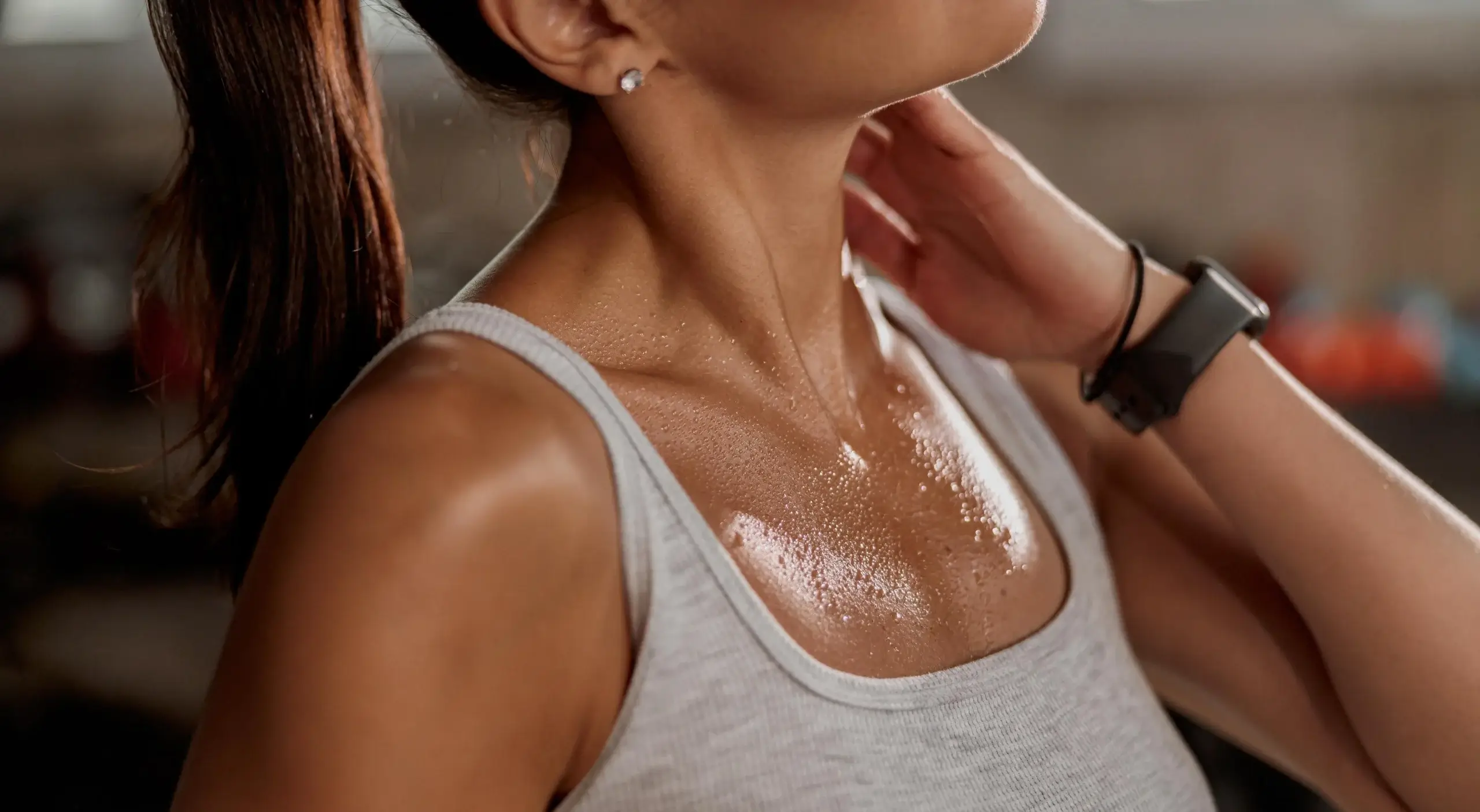 Woman experiencing hot flashes and sweating during menopause showing sudden heat and night sweats symptoms