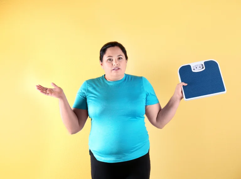 woman experiencing menopause weight gain and belly fat changes during midlife