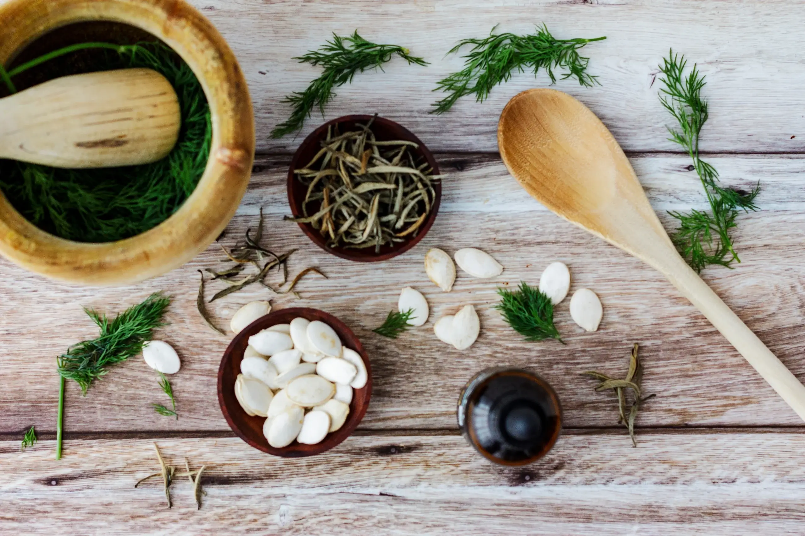 7 natural menopause treatments that really work shown through herbal ingredients flat lay with dried herbs and seeds