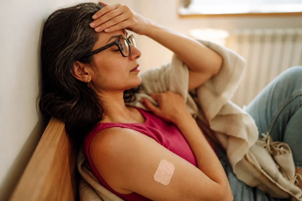 Estrogen patch for menstrual migraines: Indian woman experiencing a migraine while wearing an estradiol patch.