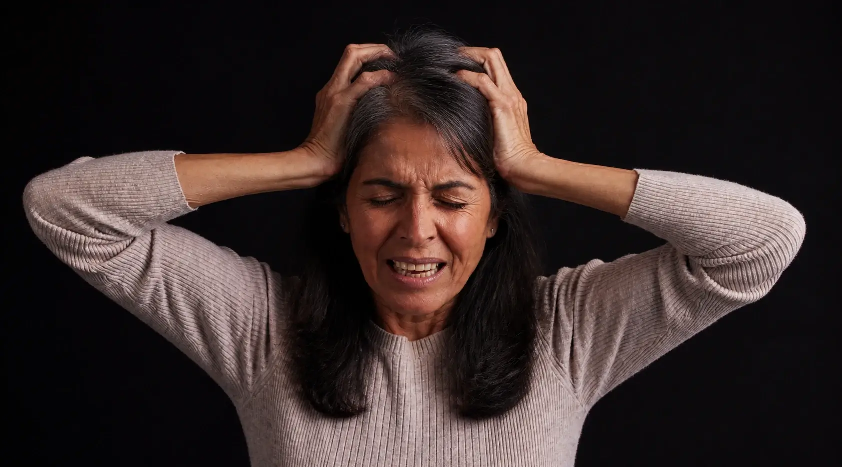 Woman experiencing menopause panic attacks with intense anxiety and distress.