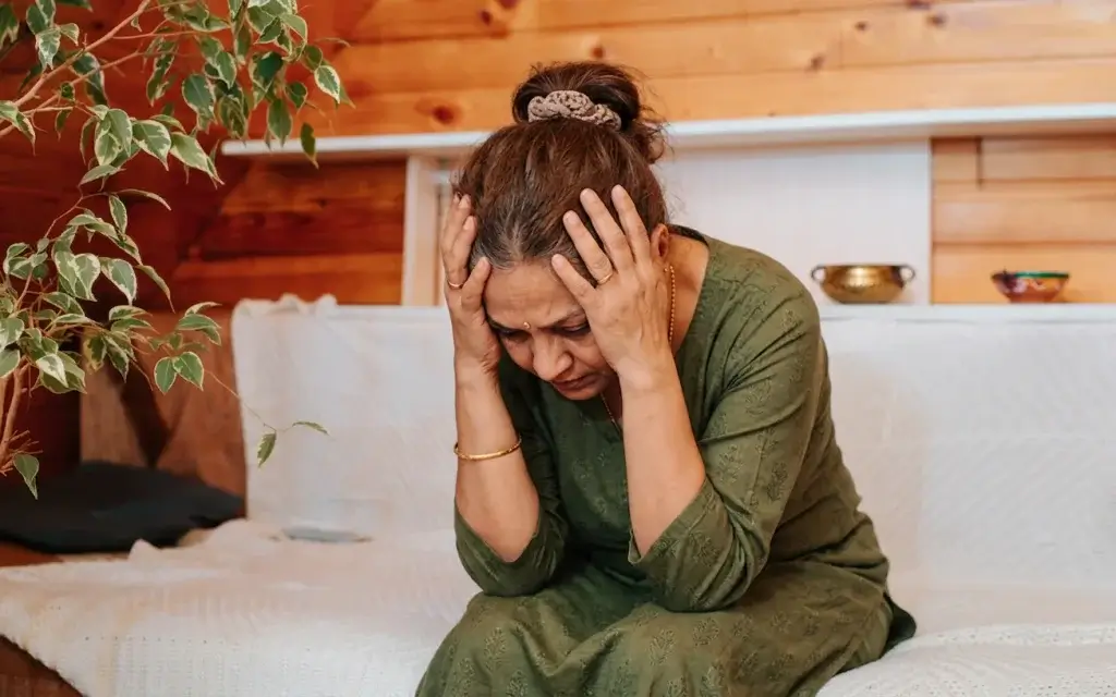 Indian woman experiencing emotional overwhelm and mental load during perimenopause