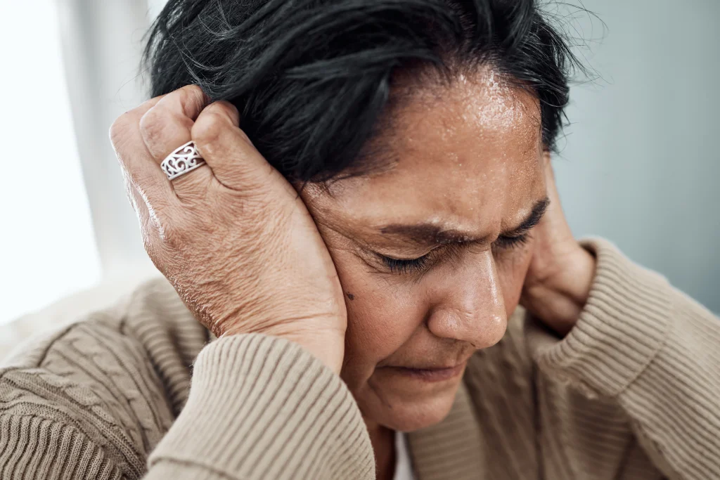 woman experiencing headache with hands covering ea 2026 01 09 10 37 18 utc